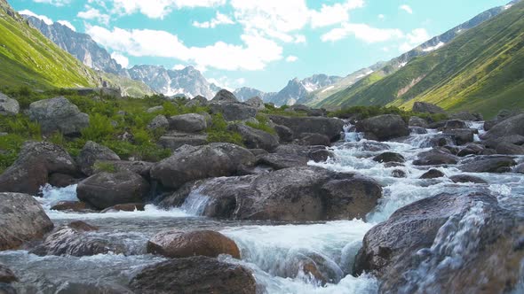 Creek at Valley in a High Altitude Mountain