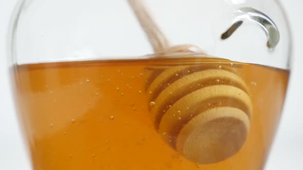 Slow motion wooden utensil in glass honey jar  1920X1080 HD footage -  Spiral dipper in sweet food s