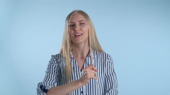 Attractive Blonde Woman Making 'Okay' Hand Sign