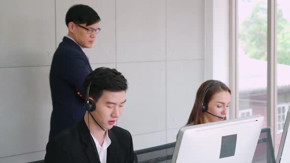 Business People Wearing Headset Working in Office