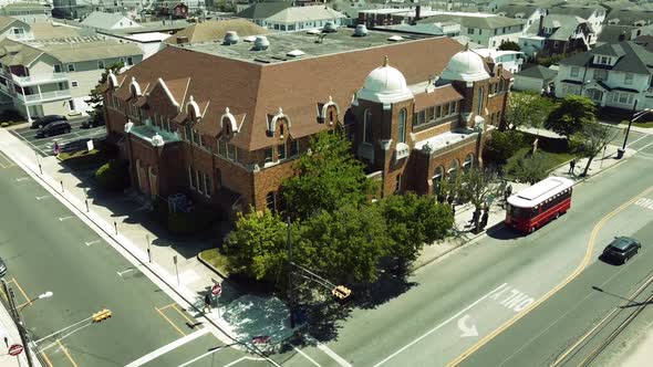 Aerial tilt up to a Catholic church near the beach in Stone Harbor, New Jersey.