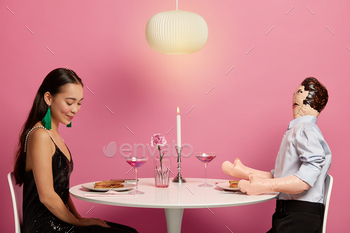  rendezvous with man, enjoy romantic atmosphere, sit at festive table, have dinner, eat sandwiches and drink cocktails. Relationship and love concept