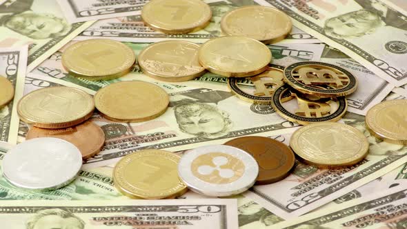 Gold Crypto Coins Rotating on Bills of 50 Dollars. Worldwide Virtual Internet Cryptocurrency.