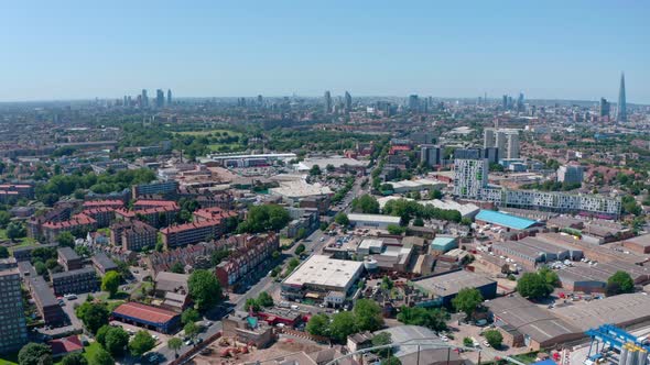 Dolly forward drone shot over South London on a sunny day