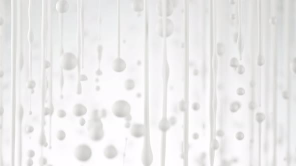 Super Slow Motion Shot of Dripping Milk on White Background at 1000 Fps.