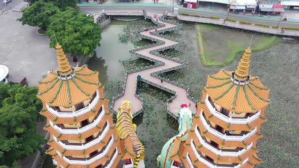 Descending tilting view from the back of the Spectacular Dragon And Tiger Pagodas Temple With Seven