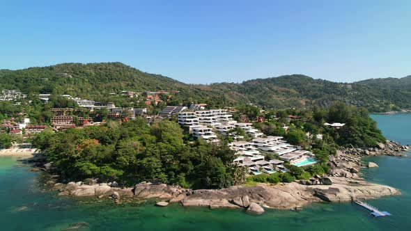 beautiful resort located on a hill view at Karon beach on a sunny tropical day with turquoise water