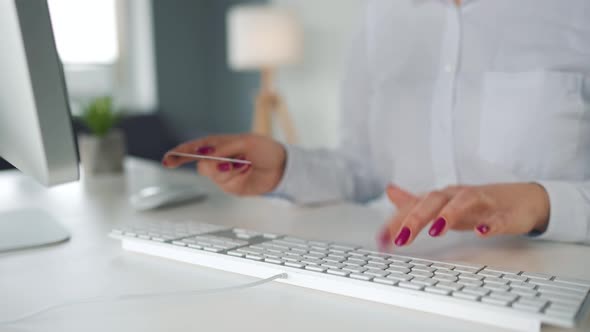 Woman Typing Credit Card Number on Computer Keyboard / Videohive
