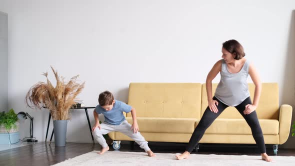 Mom and Son Work Out at Home Sports Son Inspires Mom to Do Sports