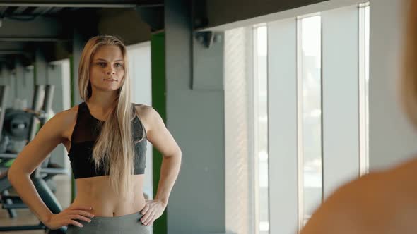 Pretty Woman Leans Raising Her Arms and Upper Hand. Female Athlete Side Tilts Her Body. alt