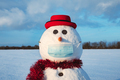 Funny snowman in stylish red hat with medical mask - PhotoDune Item for Sale
