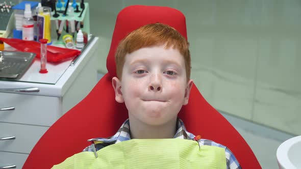 Funny Boy at Reception at Dentist in Dental Chair