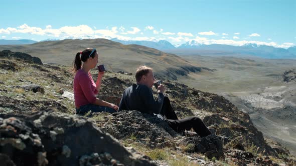 Backpacking Hikers Drinking Tea on a Mountain