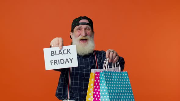 Elderly Bearded Man Showing Black Friday Inscription Banner Text Advertising Discounts Low Prices