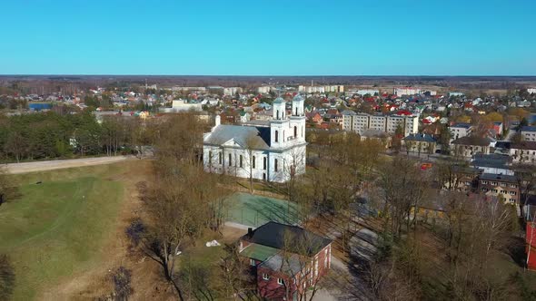 Aerial Shot of Birzai St. John the Baptist Church on the Southern Coast of the Lake Širvėna