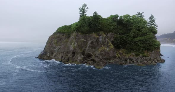 Aerial shot of Abbey Island away from shore at Ruby Beach, Olympic National Park, Washington, USA