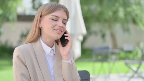 Outdoor Young Businesswoman Talking on Phone