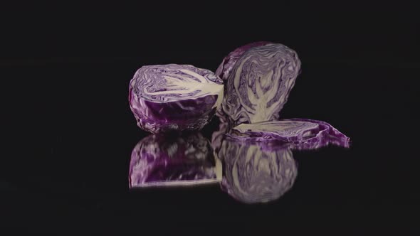 Purple Cabbage Cut In Half On A Mirror.