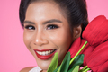 Portrait of Beautiful woman with bouquet of red tulip flowers - PhotoDune Item for Sale