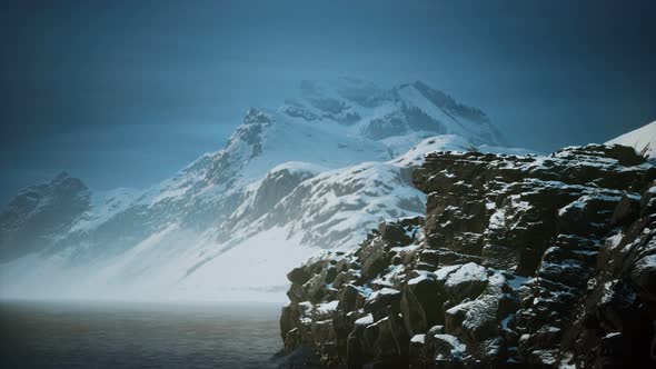 Snow Covered Mountains in Northern Ocean