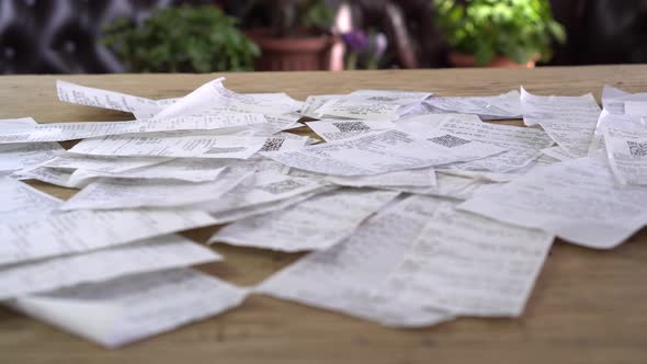 A heap of supermarket paper receipts