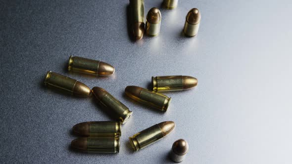 Cinematic rotating shot of bullets on a metallic surface - BULLETS 046