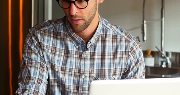 Handsome man using laptop