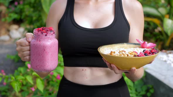 Closeup of Sport Woman with Healthy Diet Fruit Smoothie Bowl with Oatmeal