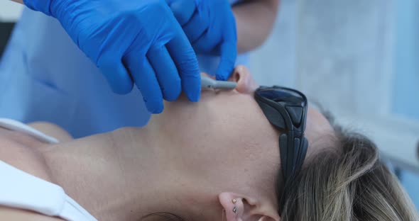 Cosmetologist Removes Hair Over Woman's Lip Closeup Face