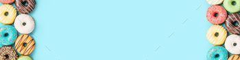 donuts on blue background, top view / Photodune, Misc