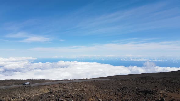 Haleakala Volcano Summit Road above the Clouds and Sky - Midday Aerial View