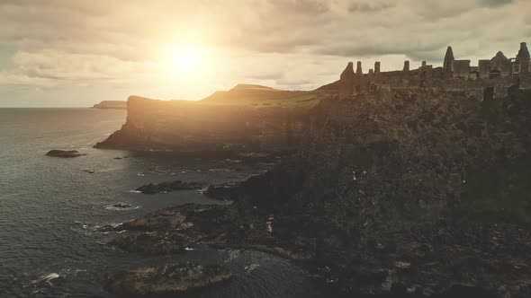 Sun Ocean Seascape Aerial. Ancient Castle Ruins on Seashore Basalt Cliffs. Nobody Nature Landscape