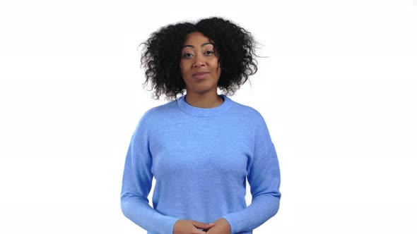 Cheerful Mixed Race Woman Showing Yes Sign Nods Her Head Approvingly