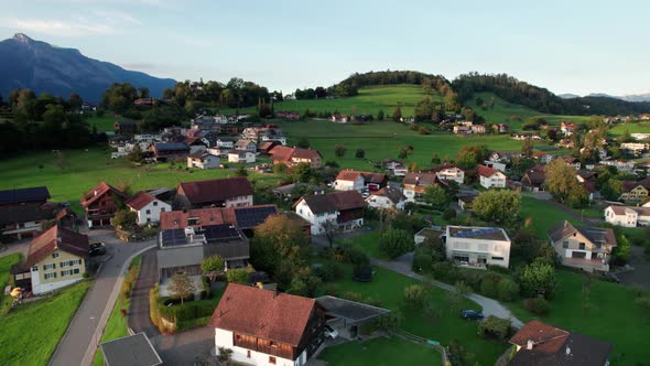 Aerial View of Liechtenstein with Houses on Green Fields in Alps Mountain Valley