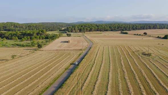 Driving through the countryside of Palau Sator Catalonia, Spain. Aerial tracking shot. Freedom Conce