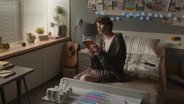 Girl Reading Book in Hospital Ward