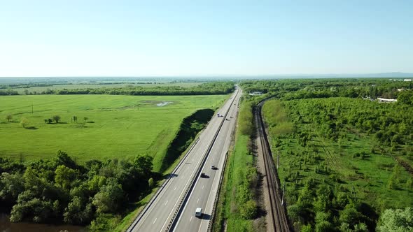 Aerial View of Cars and Truck Drive Along the Highway