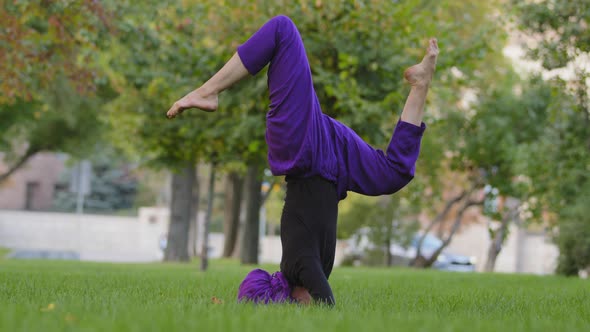Young Strong Sporty Woman in Hijab and Purple Pants Top Practicing Outdoors Girl Trainer Doing