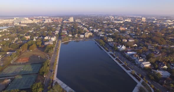 Aerial Flyover of Downtown Charleston SC and Colonial Lake in Early Morning