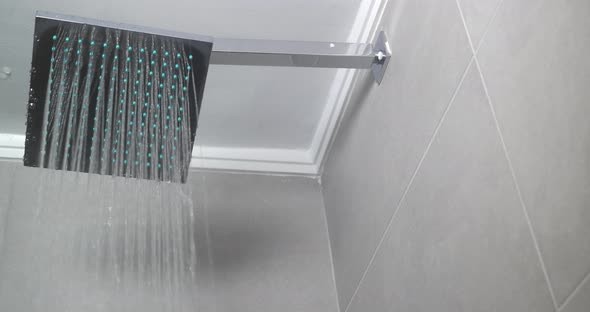 Hot Water Flowing From Square Shower Head