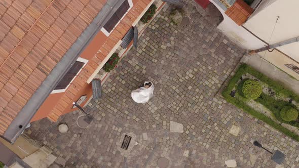 Lovely Newlyweds Caucasian Bride Groom Dancing on City Street Wedding Couple Family Aerial View