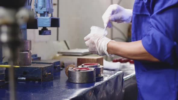 Mixed race man working in factory