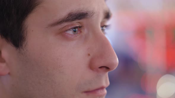 portrait of serious pensive young man at christmas time