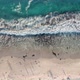 High Angle Top Down View of Blue Waves Crashing on a Pearly White Beach - VideoHive Item for Sale