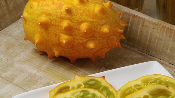 Whole and sliced kiwano fruit close up 