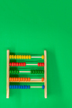 Abacus for calculations on a green background - PhotoDune Item for Sale