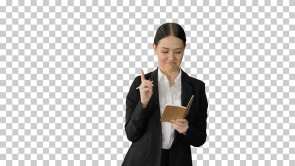 Concentrated woman in a suit writing business, Alpha Channel