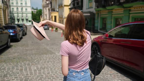 Beautiful Young Woman Tourist Pleasant Walk in the City Center