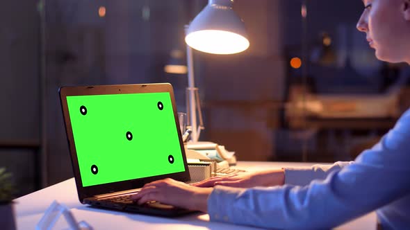 Businesswoman with Green Screen on Laptop at Night 71