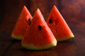Sliced ​​watermelon on a wooden table. - PhotoDune Item for Sale